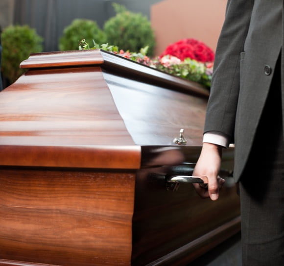 Man Carrying Casket — Newhaven Funerals in Brisbane