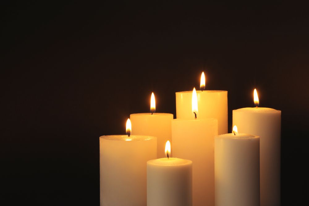 Burning Candles On Dark Background — Newhaven Funerals in Brisbane