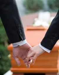 Couple At Funeral Holding Hands — Newhaven Funerals in Brisbane