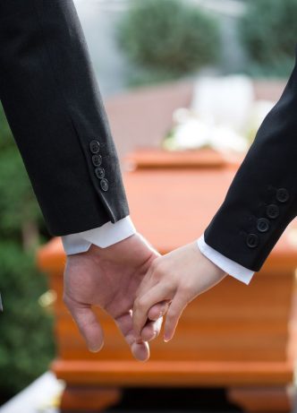 Couple At Funeral Holding Hands — Newhaven Funerals in Brisbane