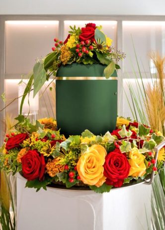 Urn With Colourful Flowers — Newhaven Funerals in Brisbane