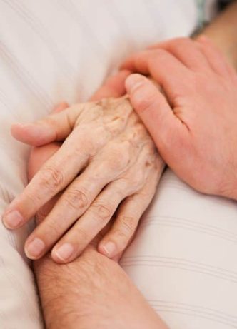 Holding Hands — Newhaven Funerals in Logan, QLD