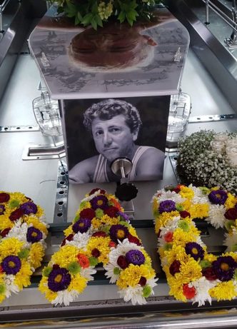 Casket And Flowers In Hearse — Newhaven Funerals in Brisbane