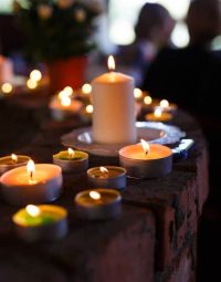 Collection Of Lit Candles — Newhaven Funerals in Brisbane