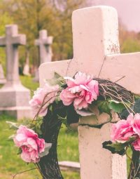 Funeral Wreath With Pink Flower On A Cross