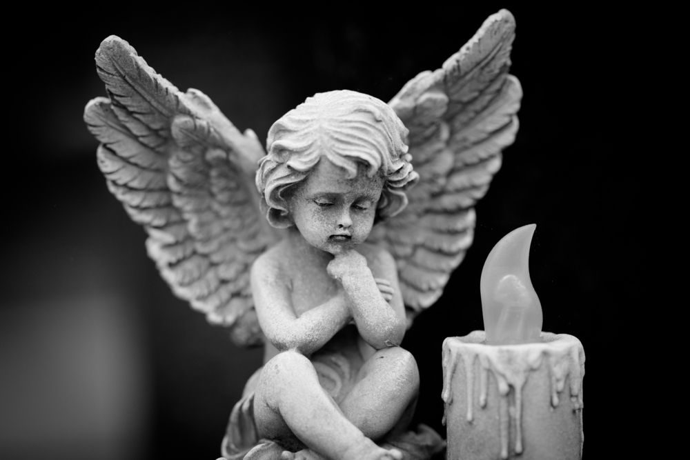 Angel And Candle — Newhaven Funerals in Brisbane
