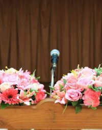 Flowers On Podium — Newhaven Funerals in Brisbane