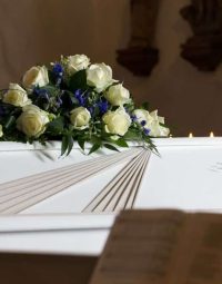 Coffin With Flowers — Newhaven Funerals in Brisbane