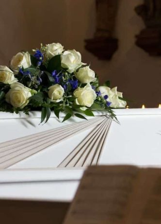 Coffin With Flowers — Newhaven Funerals in Brisbane