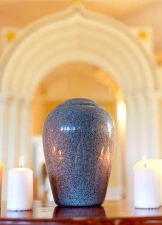 Urn And Candles On Table — Newhaven Funeral Home Gold Coast