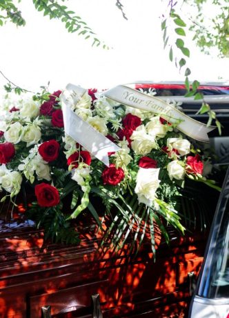 Loading Casket Into Car — Newhaven Funerals in Brisbane